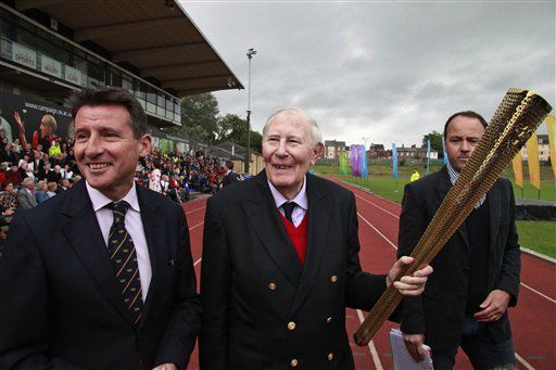 Roger Bannister carries Olympic torch on fabled track