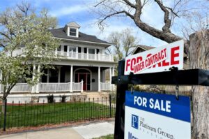 A For Sale sign is pictured outside a home in Colorado Springs
