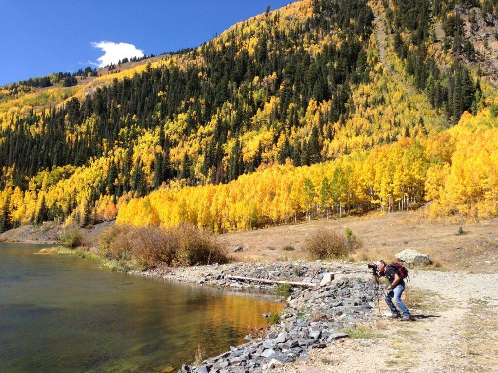 A photographer takes photos of the fall color around Crystal Lake off the Million Dollar Highway above Ouray. Photo courtesy Tamara Gulde